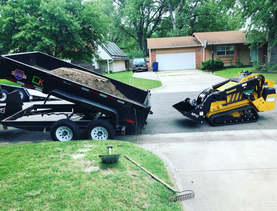 C.K. Tree Service crew working on a tree in a Wichita, KS yard